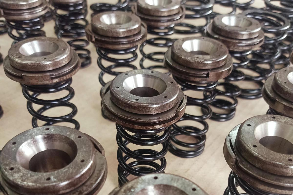 Offshore mechanical engineer performing marine engine overhaul inside ship engine room