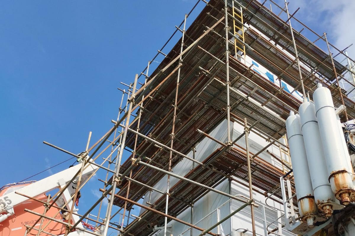 Offshore scaffolding system installed on vessel hull for safe access during marine maintenance and repair operations