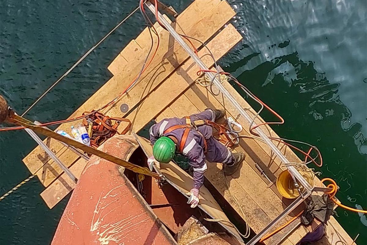 Offshore scaffolding system installed on vessel hull for safe access during marine maintenance and repair operations